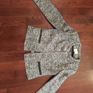 Tweed jacket with black leather pockets